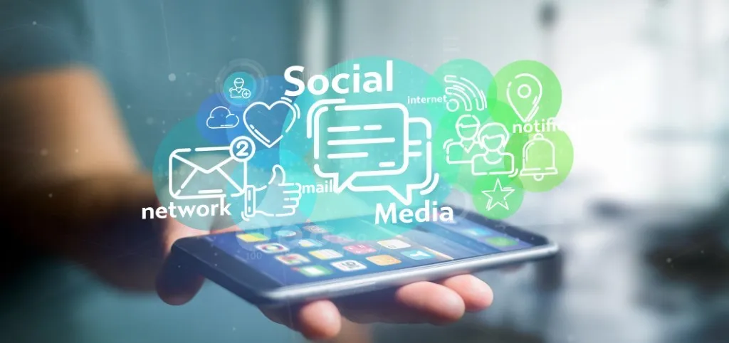 Close-up of a hand holding a smartphone with various social media icons and notifications overlayed, illustrating the concept of digital communication and social media engagement.