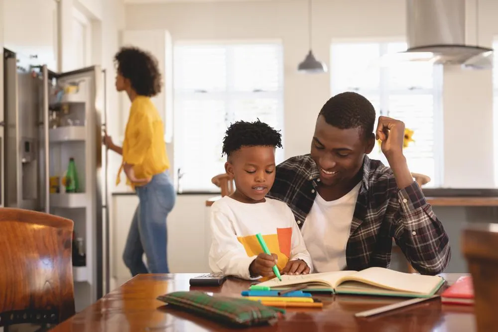 father doing home exercises with his son