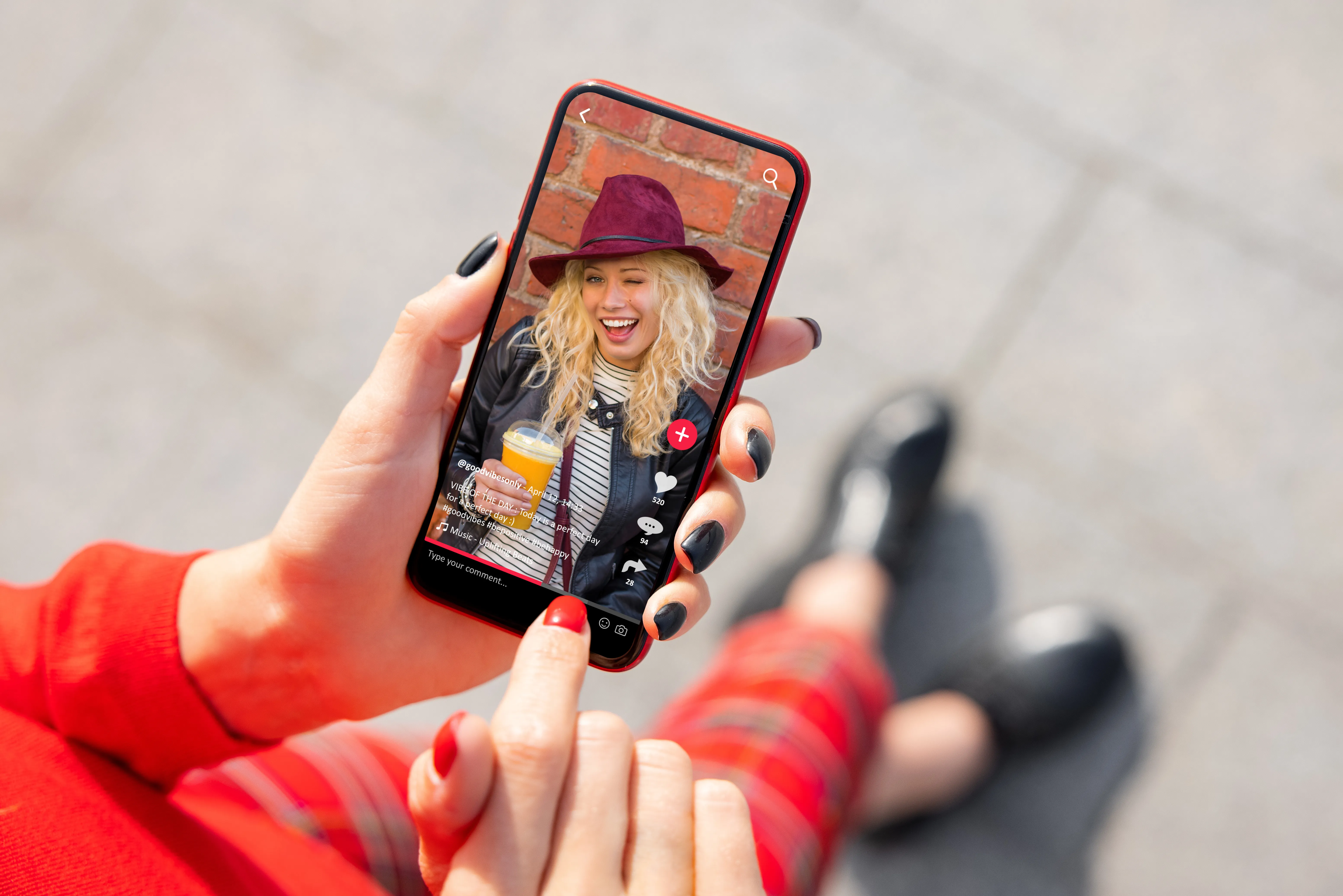 Woman using a smartphone to view a social media video.