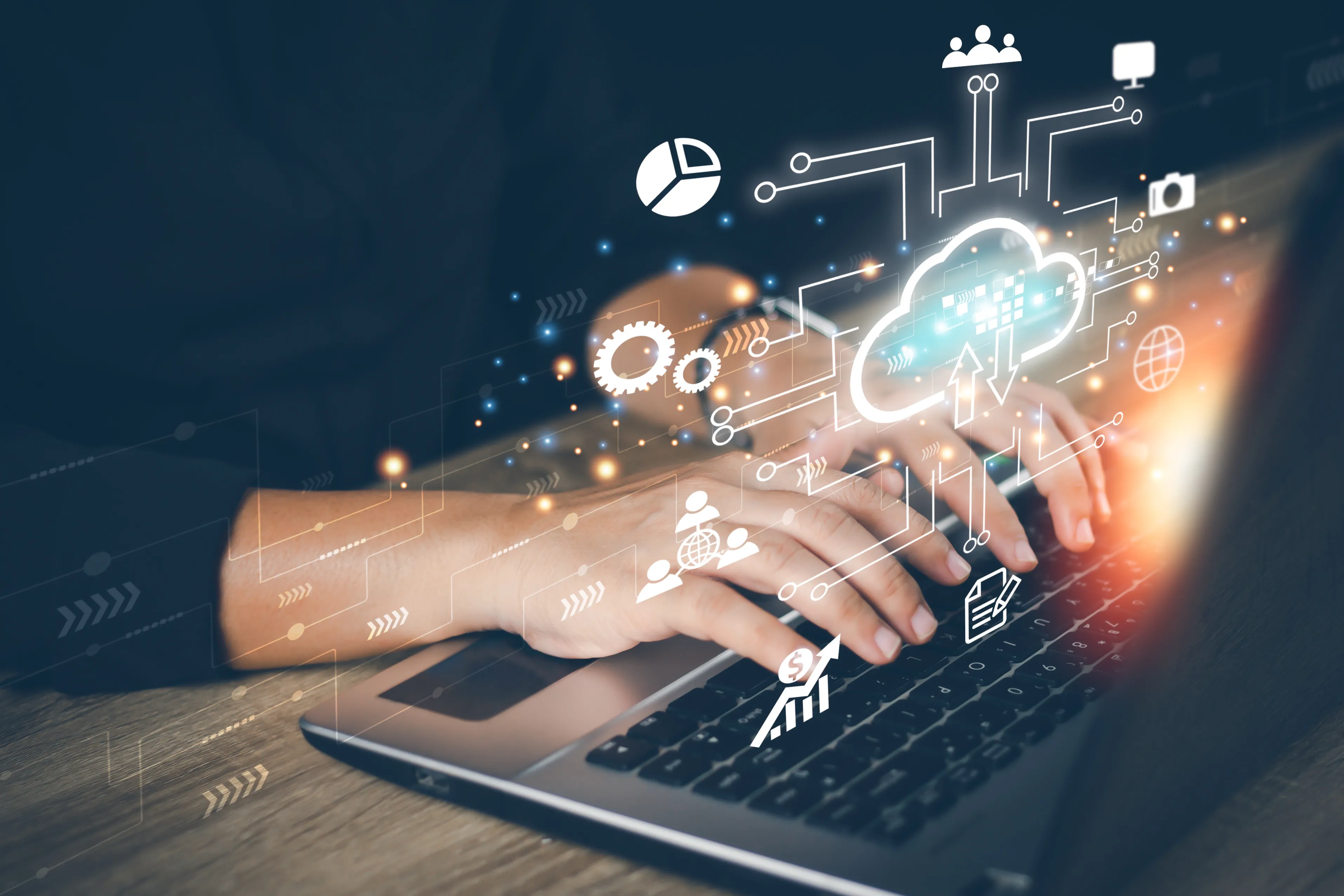 Hands typing on a laptop with digital icons and a cloud computing graphic overlay